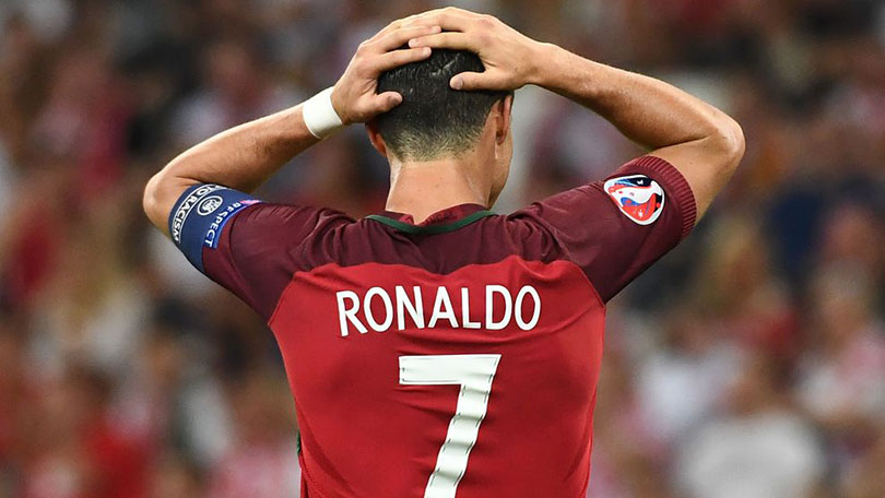 Portugal's forward Cristiano Ronaldo reacts during the Euro 2016 quarter-final football match between Poland and Portugal at the Stade Velodrome in Marseille on June 30, 2016. / AFP / ANNE-CHRISTINE POUJOULAT (Photo credit should read ANNE-CHRISTINE POUJOULAT/AFP/Getty Images)