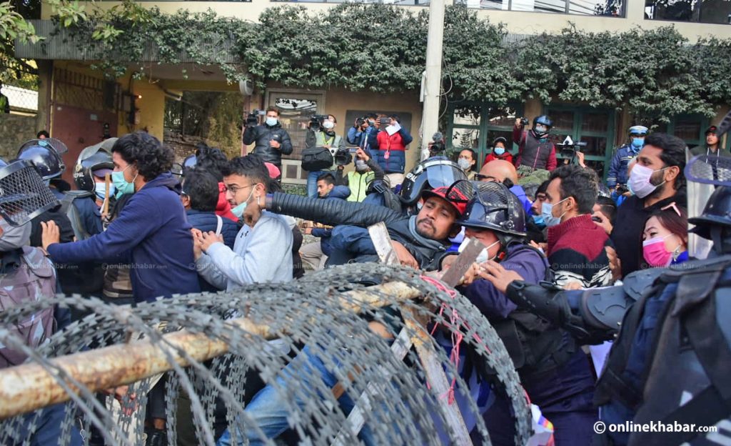 Police try to stop protestors outside the Prime Minister's residence, in Kathmandu, on Monday, January 25, 2021. Photo: Chandra Bahadur Ale