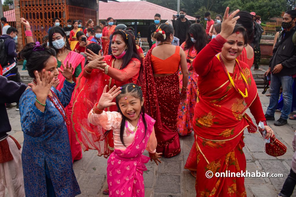 Girls and women are seen dancing at the Pashupatinath area, in Kathmandu, on Thursday, September 9, 2021.  