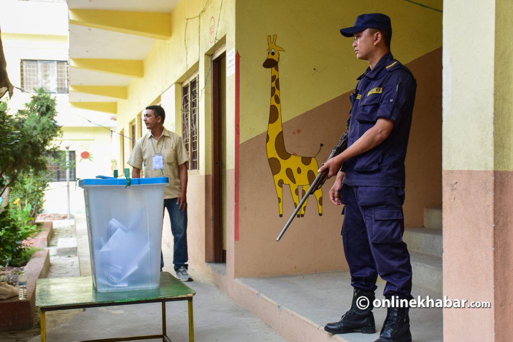 Police personnel guarding the ballot box during the local elections on May 14. 