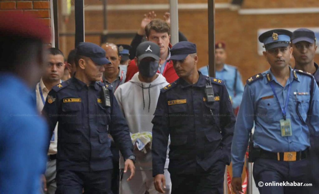 Police arrest rape-accused cricket star Sandeep Lamichhane at the Kathmandu airport, on Thursday, October 6, 2022. Photo: Aryan Dhimal