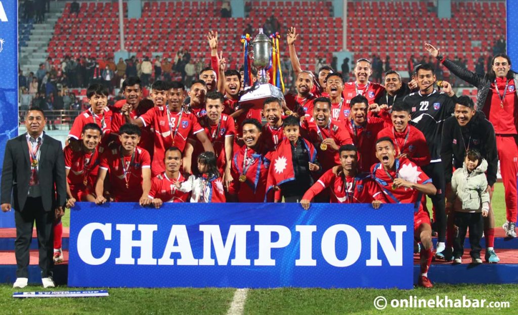 Nepal football team celebrate with the Prime Minister's Three Nations Cup at Dashrath Stadium on March 31, 2023. Photo: Chandra Bahadur Ale