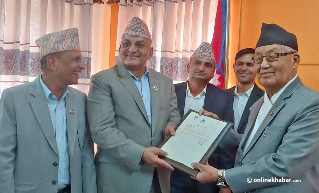 Nepali Congress leader Surendra Raj Pandey receives a letter of appointment as the chief minister of the Gandaki province, in Pokhara, on Thursday, April 27, 2023.