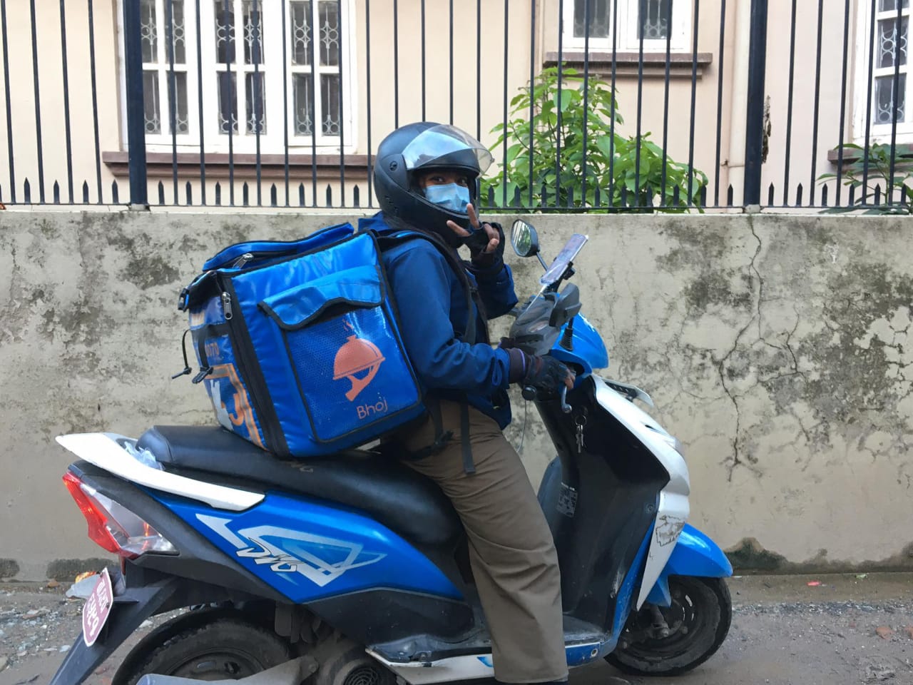 A female delivery rider for Bhoj. Photo Courtesy: Bhoj