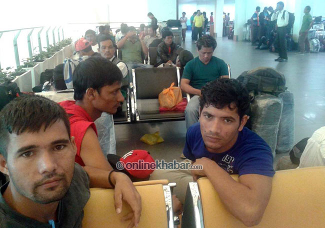 File image: Nepali migrant workers at a Malaysian airport 