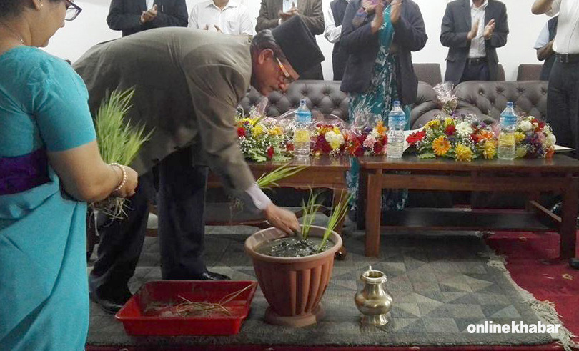 On Paddy Day, Hari Bol Gajurel, Nepal’s Agriculture Minister, turns flower pot into field