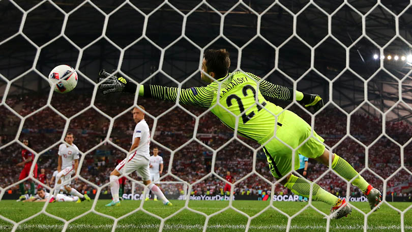 MARSEILLE, FRANCE - JUNE 30: Lukasz Fabianski of Poland dives in vain as Renato Sanches (1st L) of Portugal scores his team's first goal during the UEFA EURO 2016 quarter final match between Poland and Portugal at Stade Velodrome on June 30, 2016 in Marseille, France. (Photo by Lars Baron/Getty Images)