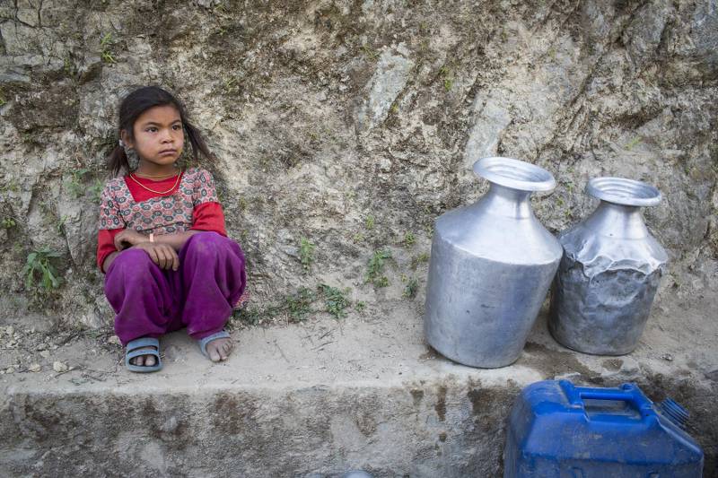 Bishnu Magar awaits her turn to fetch drinking water in Udayapur, Nepal. (Photo: Nabin Baral)