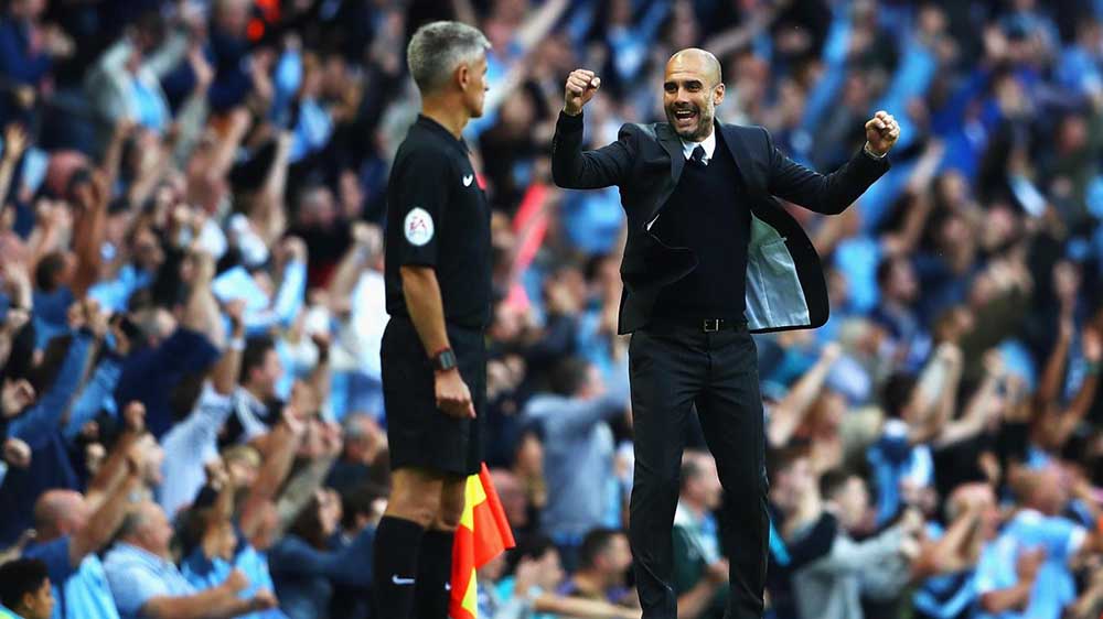 Pep Guardiola celebrates as he gets off to a winning start