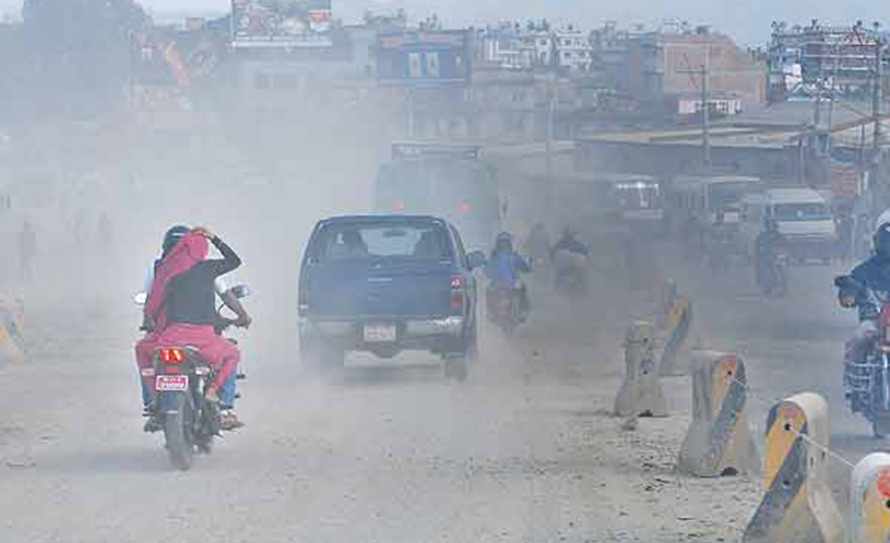 File: A dusty road in Kathmandu and air pollution