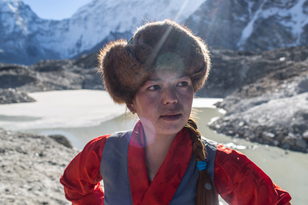 Kalma Lama, from lukla, runs a shop in Dengboche. She is happy that the risk from the lake is lowered by lowering the water level of Imja by 3.4m. She is here in Imja Lake today to attend the completion ceremony of much-awaited Imja Lake Lowering Project. 23 November 2016. She has already experience samall glacial lake outburst flood that tiggred from Lotse Glacier last summer. She says, " Althrough there was no lose the flow of flood in the Imja River was terrifiying. Imja Lake, Everest Region, Dolakha District Nepal