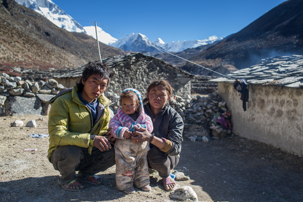 Ajit Rai and his wife Ranjita Rai works as labourer in Dengboche Village, the way to Imja Glacier and Everest Base Camp. Ajit Says, " Last year a small flash flood tiggred from other glaicial lake that mixed with imja river, althrough ,it only destroyed one bridge near Dengboche, it has made me to think more about safety of my family". Solukhumbu District, Nepal.