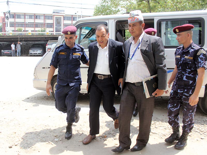 File image: Former revenue official Chudamani Sharma being taken to court by a CIAA team