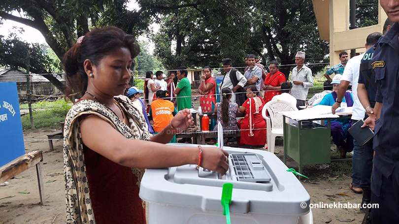 A woman casts her vote during the third phase of local elections in Bara district of Madhes (then Province 2), on Monday, September 18, 2017.