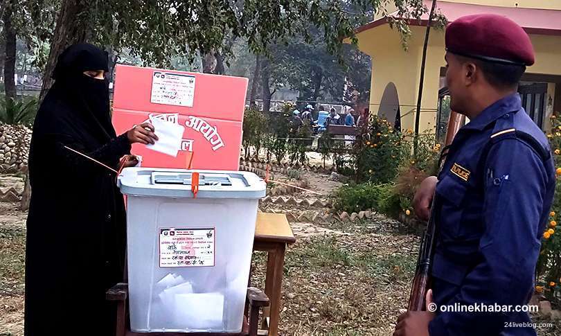 File: A woman casts her vote during parliamentary elections on December 7, 2017.