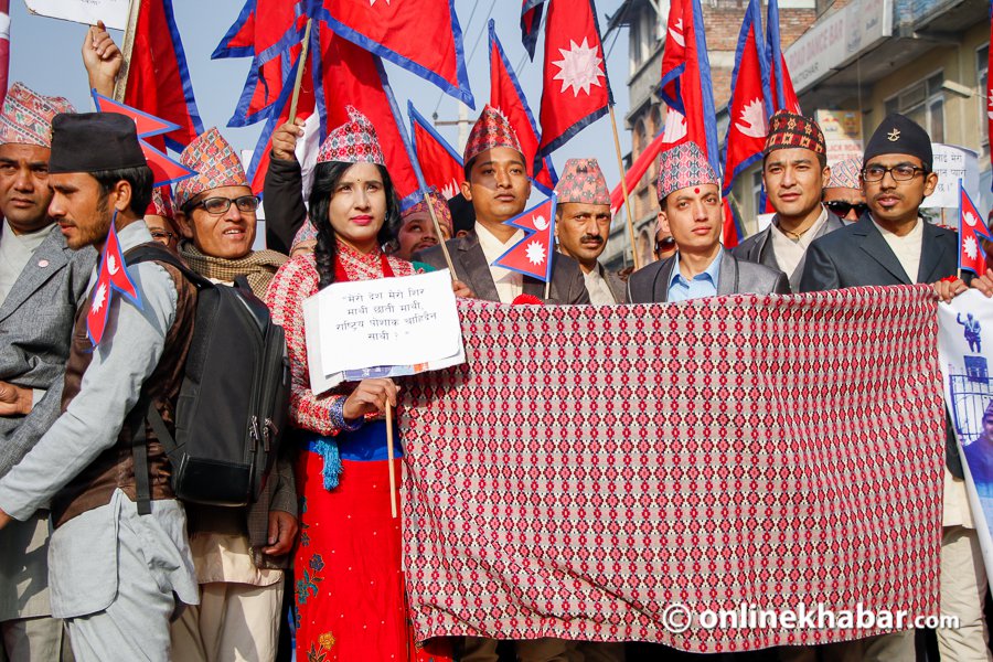nepali people wearing various Nepali topi