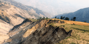 Why do people continue to live near landslides?