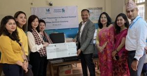Standard Chartered Bank donates Rs 3.7 million and laptops to Maiti Nepal
