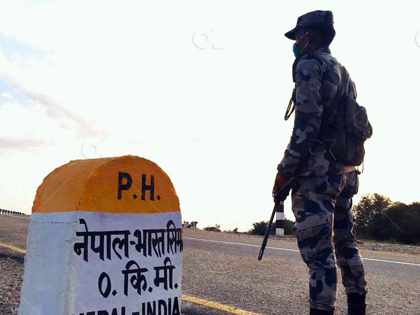 File: An Armed Police Force staffer guards Nepal-India border