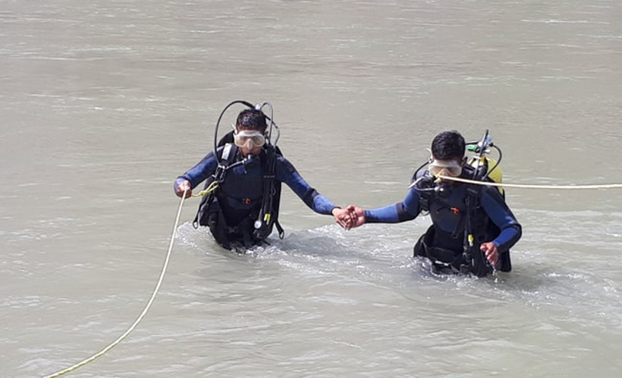File: Armed Police Force personnel search for some youth missing in Bheri, on Wednesday, May 27, 2020.