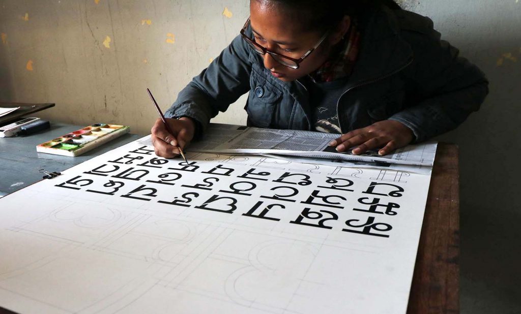 Ashlesha Maharjan, student of Graphic Communications in Sirjana College of Fine Arts, designing her Nepali font. Photo Courtesy: Bijaya Maharjan