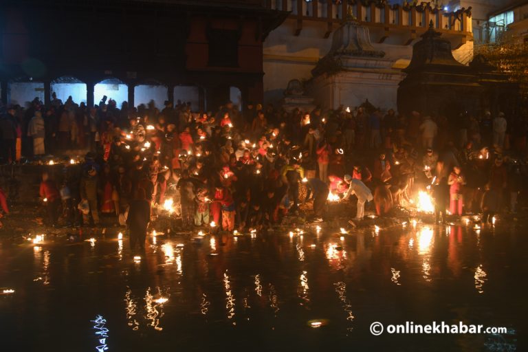 Devotees light diyos on the eve of the Balachaturdashi festival in Pashupati of Kathmandu. 