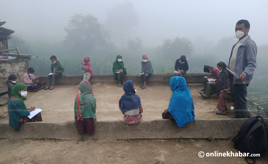 File: Students studying in the open at a school in Mugu