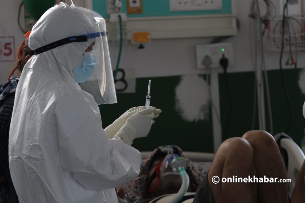 File: A health worker attends to a Covid-19 patient at Bheri Hospital, Nepalgunj. Photo: Chandra Bahadur Ale