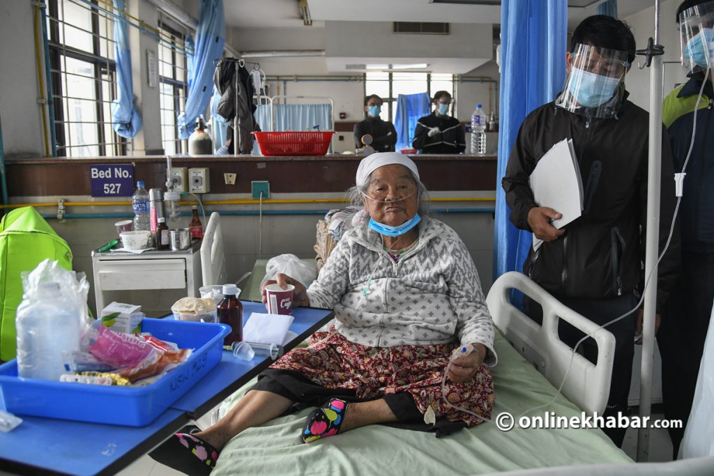 An 88-year-old woman waiting to be discharged from the National Trauma Centre after she recovered from Covid-19. Photo: Chandra Bahadur Ale