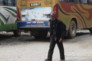 As Kathmandu lockdown begins, dozens such as this septuagenarian walk kilometres to go home