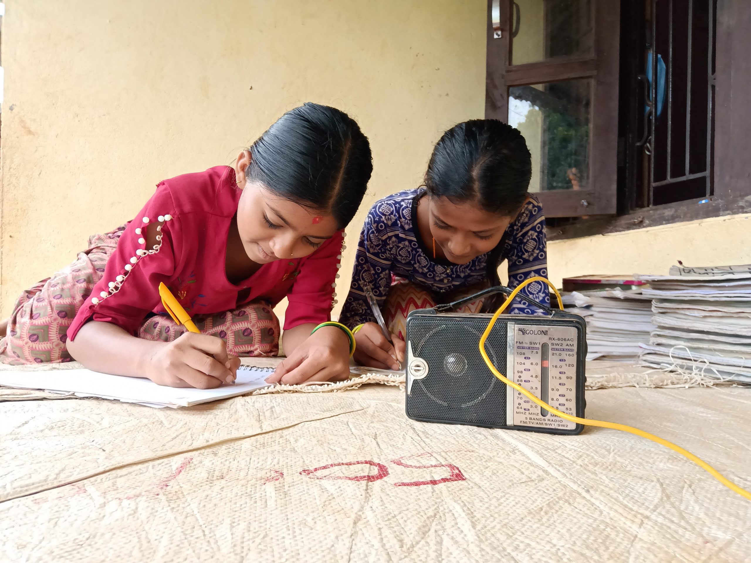 radio Youngs girls in Nuwakot listening to Balika Shiksha Chautari, a radio program by Room to Read