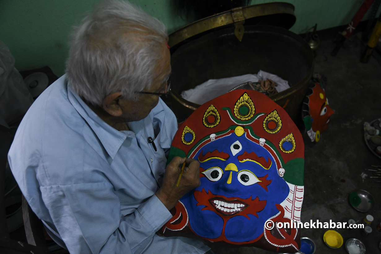 Tej Bahadur Chitrakar working on Aakash Bhairav's mask.