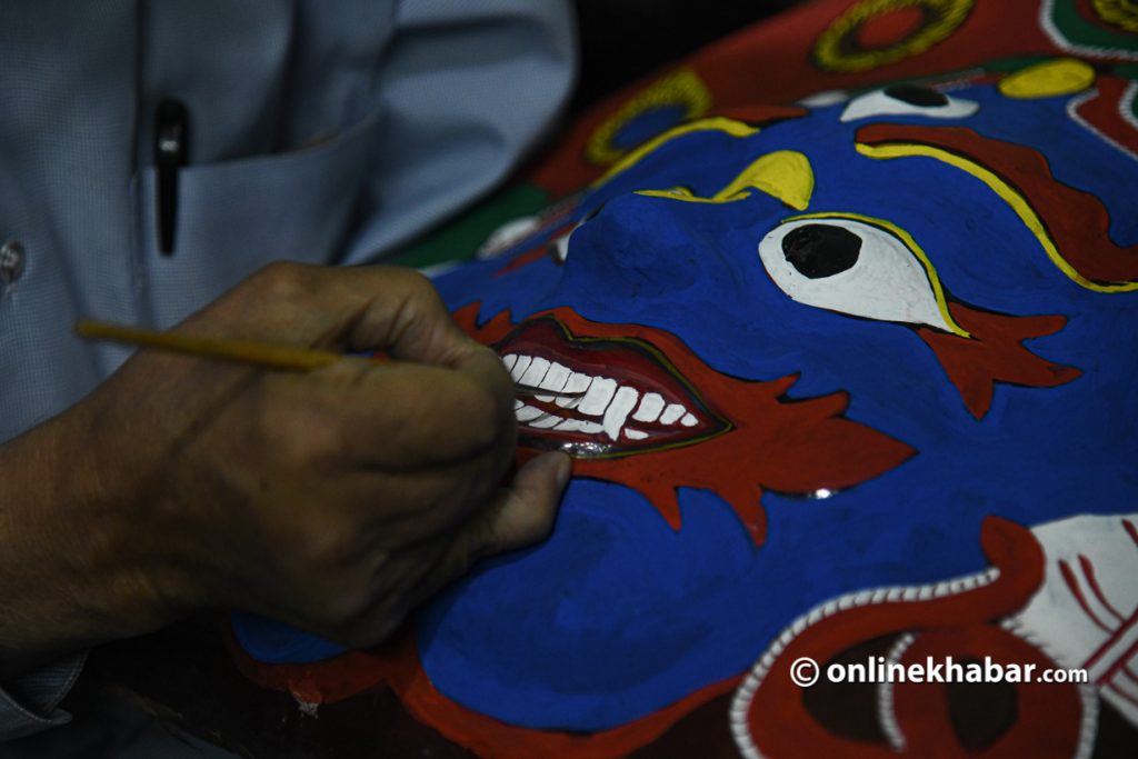 ej Bahadur Chitrakar working on Aakash Bhairav's mask