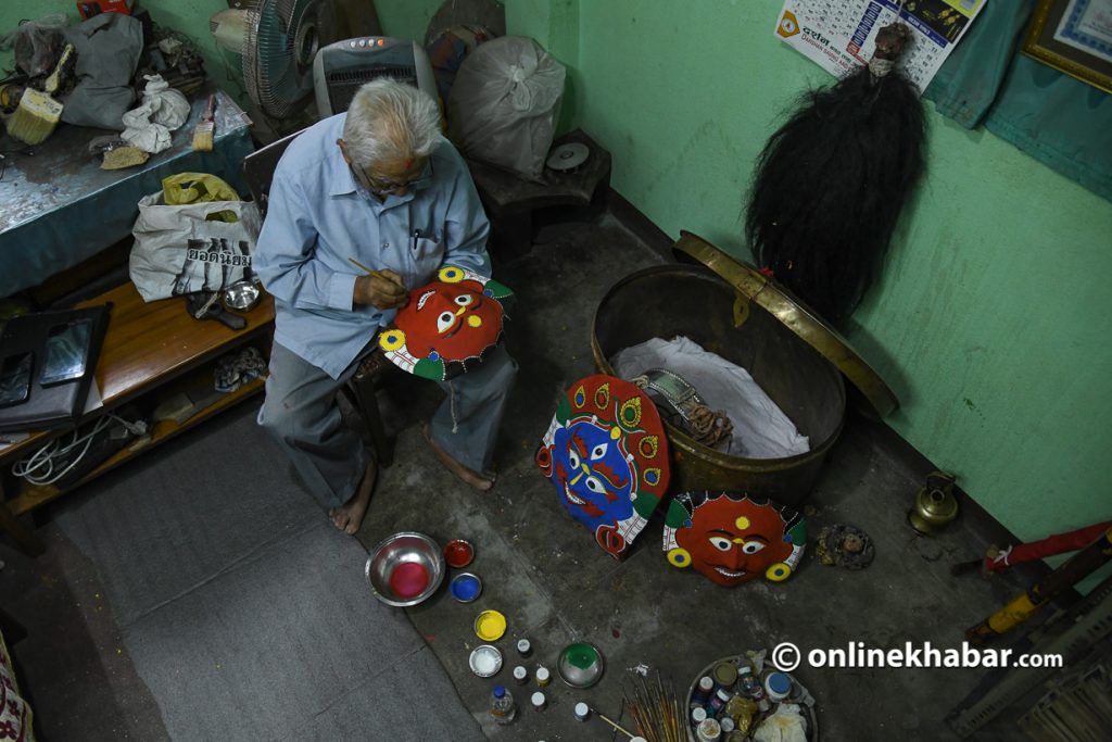 Tej Bahadur Chitrakar working on Chandi Kumari's mask for upcoming Aakash Bhairav naach