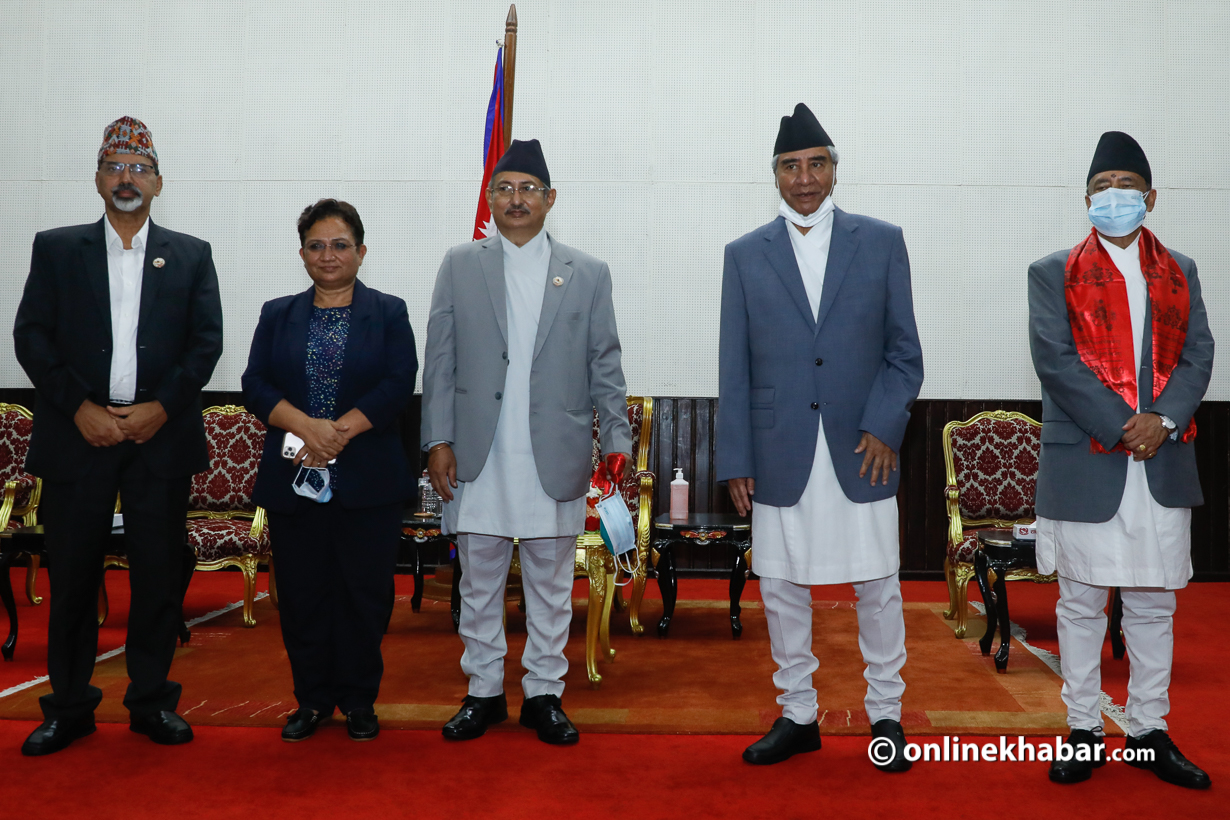 Prime Minister Sher Bahadur Deuba poses for a photo with four members of his cabinet after taking the oath of office and secrecy from President Bidya Devi Bhandari, on Tuesday, July 13, 2021.
