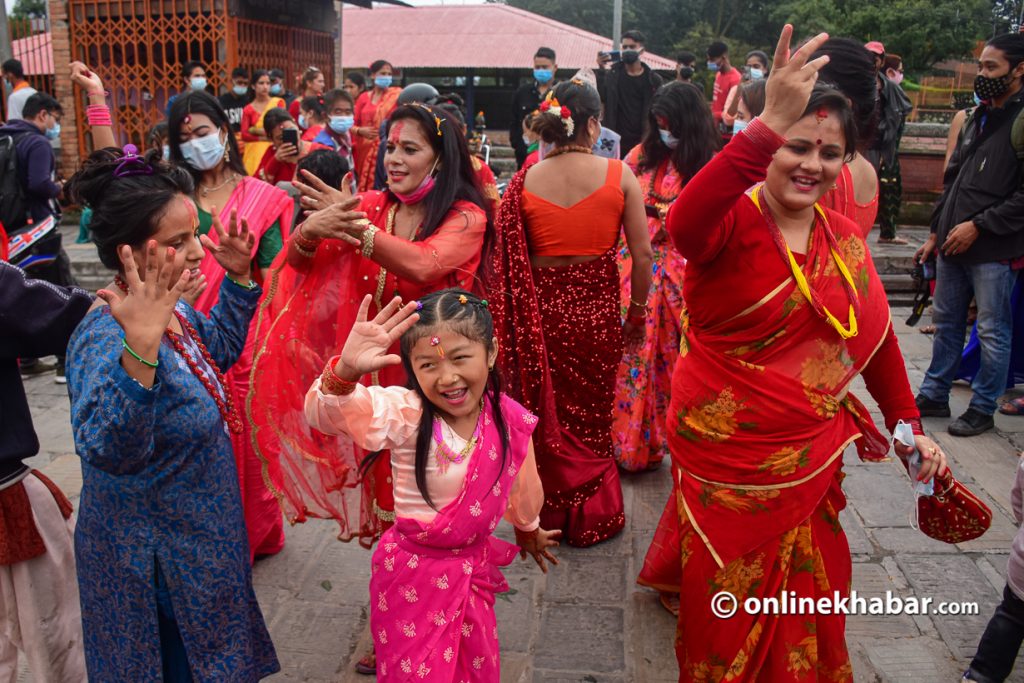 Girls and women are seen dancing in the Pashupatinath area on the occasion of Teej, in Kathmandu, on Thursday, September 9, 2021.  