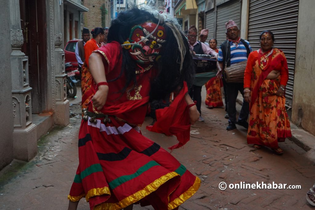 Rasna Shrestha performing in the streets of Tokha, in September 2021, as a Lakhe. Photo: Chandra Bahadur Ale