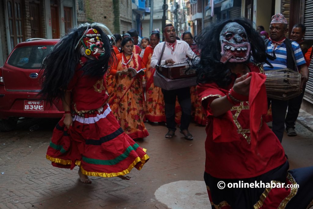 Rasna Shrestha (left) performing as Milpu Lakhe with Bhakku in the streets of Tokha, on Sunday. Photo: Chandra Bahadur Ale