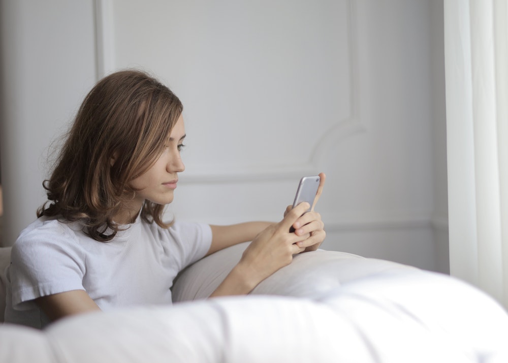 WOMAN USING PHONE FOR SUICIDE PREVENTION 