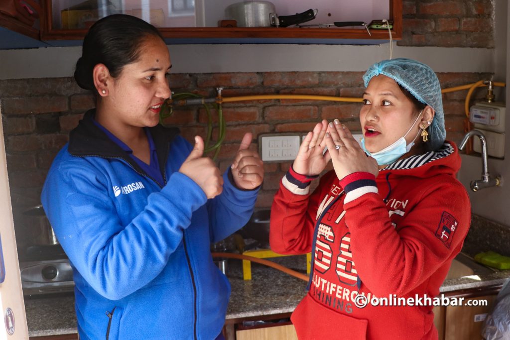 Chanda Nepal with her colleague