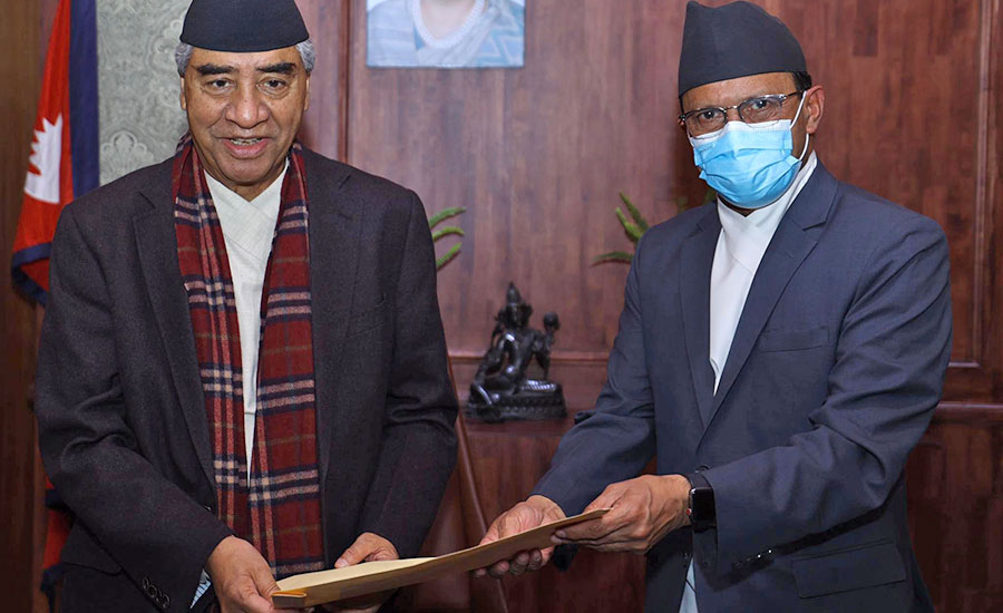Defence Minister Minendra Rijal hands over his resignation letter to Prime Minister Sher Bahadur Deuba, in Kathmandu, on Thursday, December 16, 2021.
