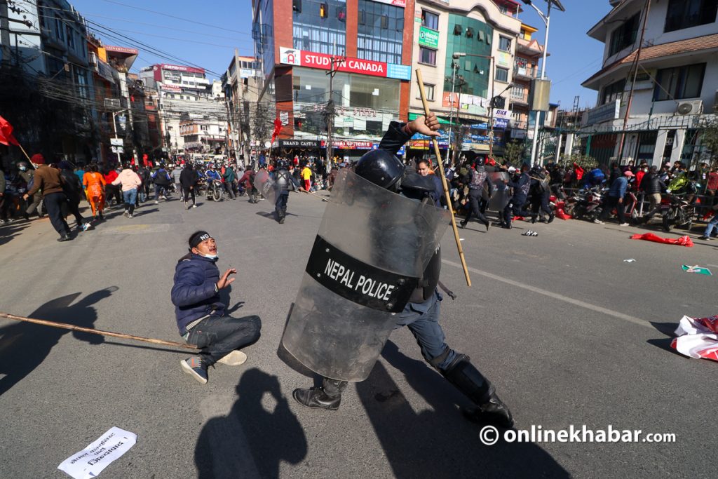 Protesters clash with riot police during a protest against the Millennium Challenge Corporation (MCC) agreement that Nepal signed with the United States, in Kathmandu, Nepal on December 14, 2021. The agreement signed in 2017 has not yet come into effect in Nepal due to protests from different groups. Photo: Aryan Dhimal