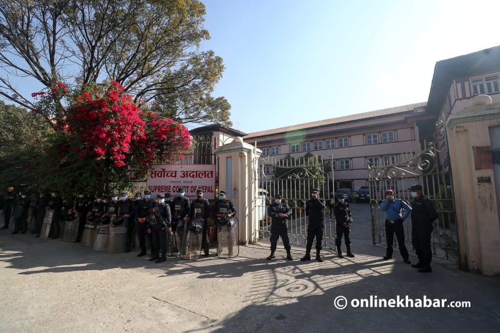 Police stand guard outside the Supreme Court to top agitating lawyers from entering the court premises. Photo: Aryan Dhimal