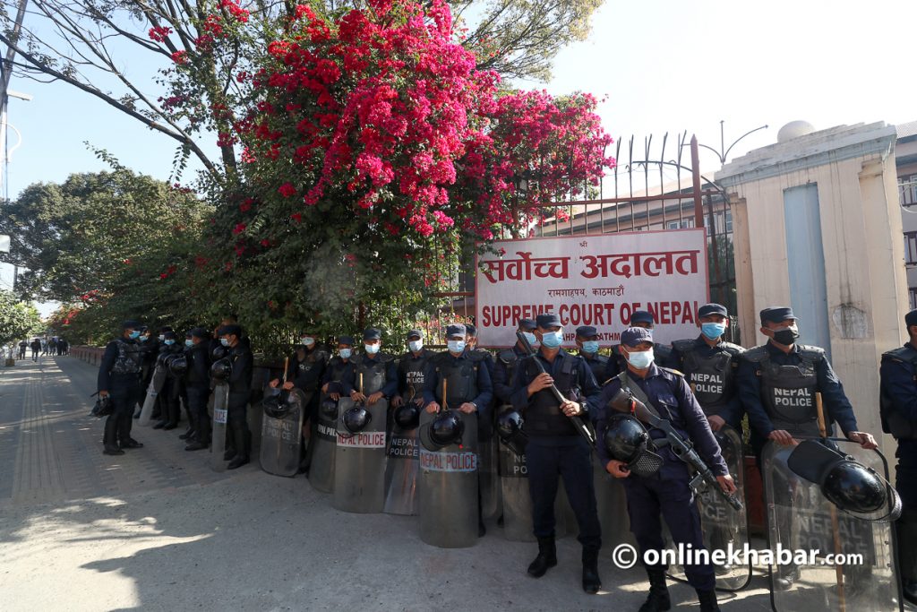 Police stand guard outside the Supreme Court to top agitating lawyers from entering the court premises. Photo: Aryan Dhimal