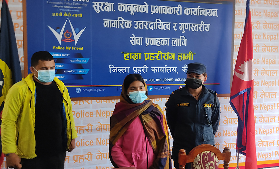 Police parade a woman arrested on the charge of murdering her stepson, in Kailali, in December 2021.
