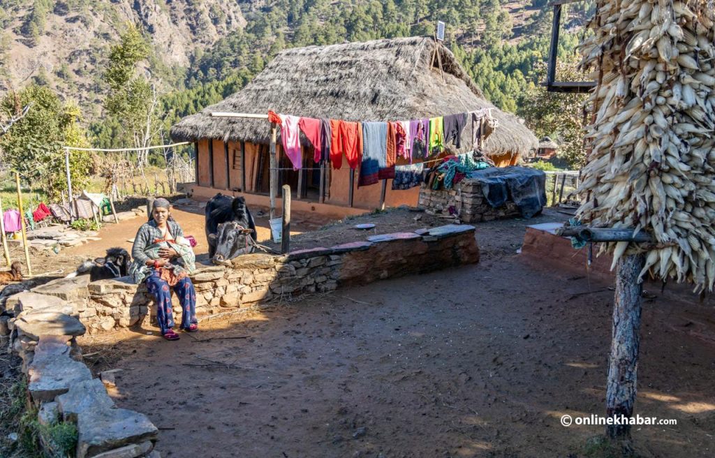 Bhusara KC outside her shed where she spent first few days as the new mother, in the Karnali province of Nepal.