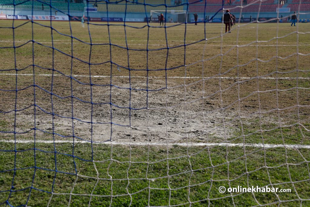 The penalty area of Dasharath Stadium is the worst part of the pitch. Photo: Shankar Giri