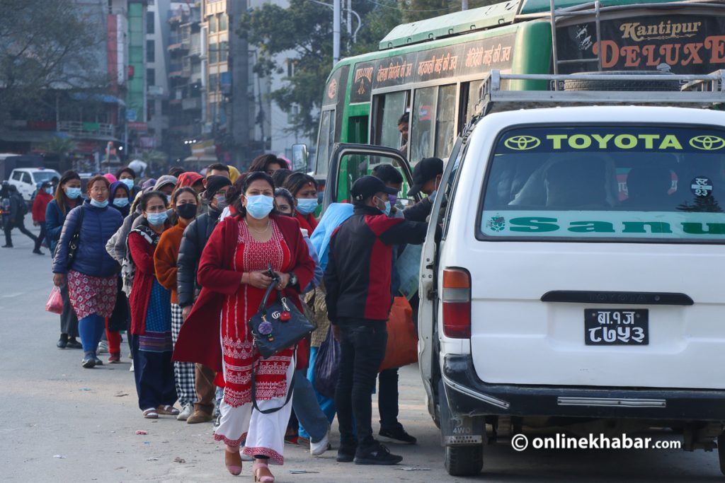 File: A crowd is ready to board a microbus in Covid-19-hit Kathmandu.