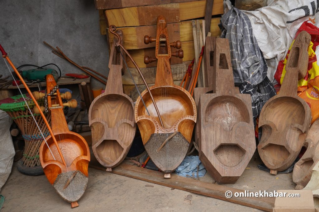 Different types of sarangi are put on sale.