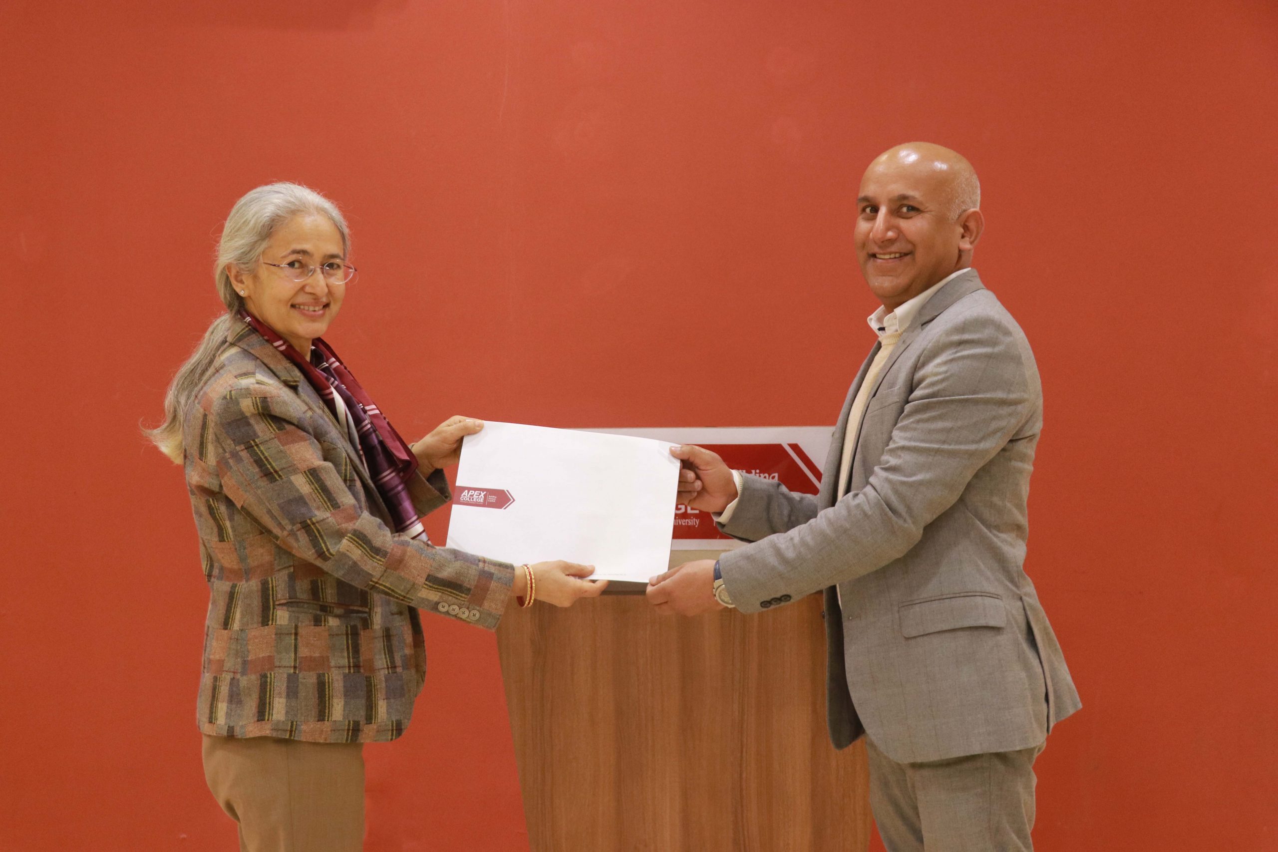 Apex College Principal Durga Rijal (l) appoints former Nepal Tourism Board CEO Deepak Raj Joshi as the college's industry advisor, in Kathmandu, in February 2022. Photo: Apex College